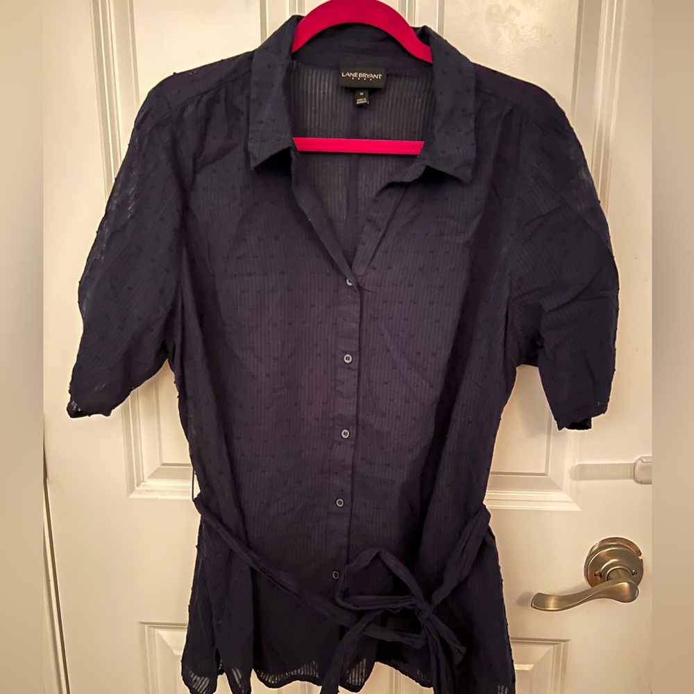 Pretty navy blue short sleeve shirt with rouching on arms , and belt